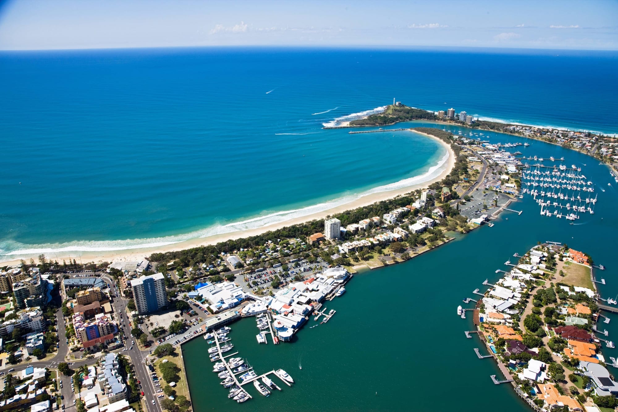Aerial view of the Sunshine Coast showing pristine coastal properties and waterways requiring professional pressure cleaning services